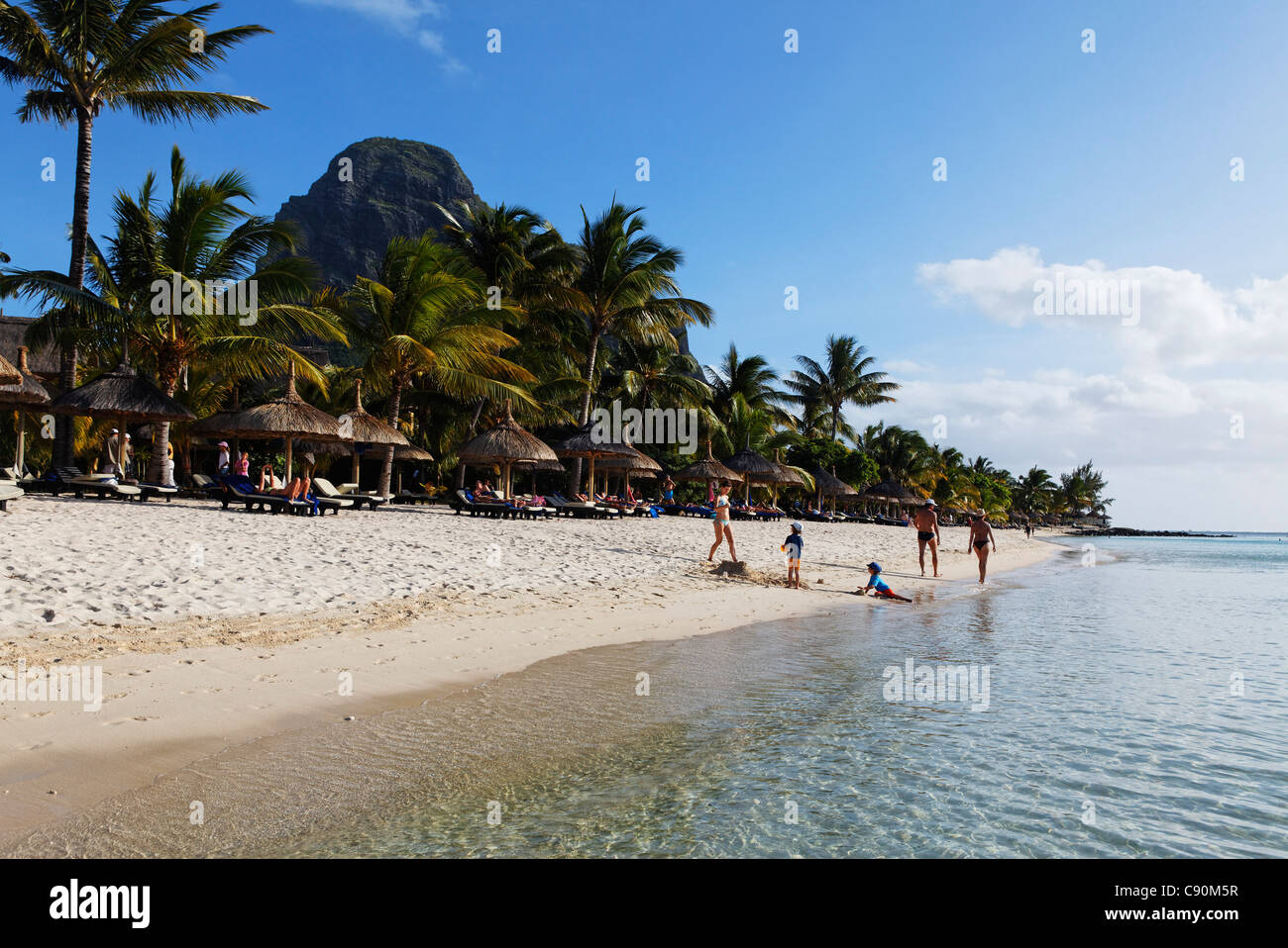 Beach and Le Morne Brabant mountain in the sunlight, Beachcomber Hotel Paradis &amp; Golf Club, Mauritius, Africa Stock Photo