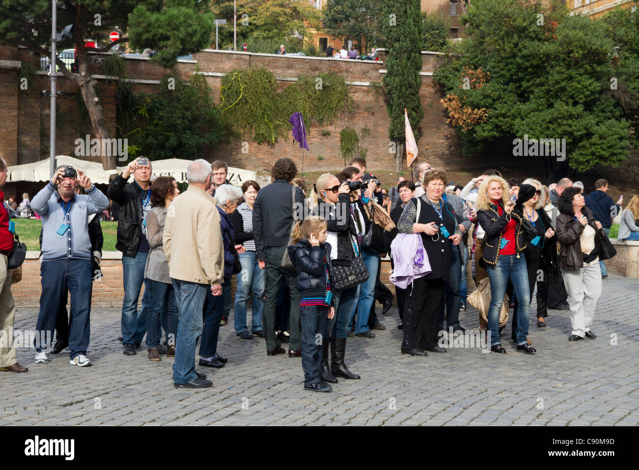 Group of tourists looking Colosseum monument, Rome Italy Stock Photo