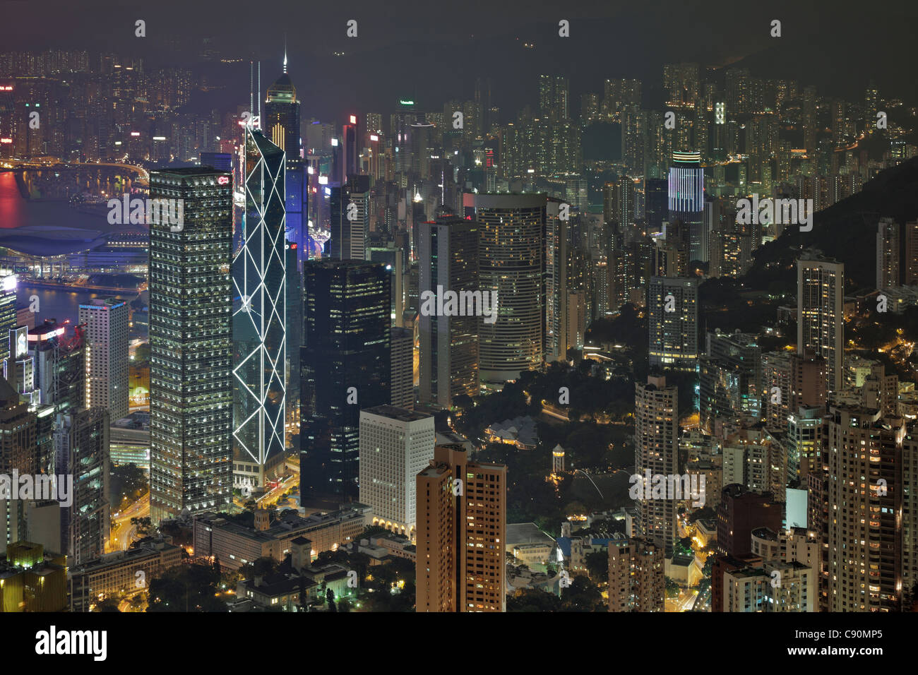 View of Hong Kong from Victoria Peak towards the illuminated skyscrapers at night, Hong Kong, China Stock Photo