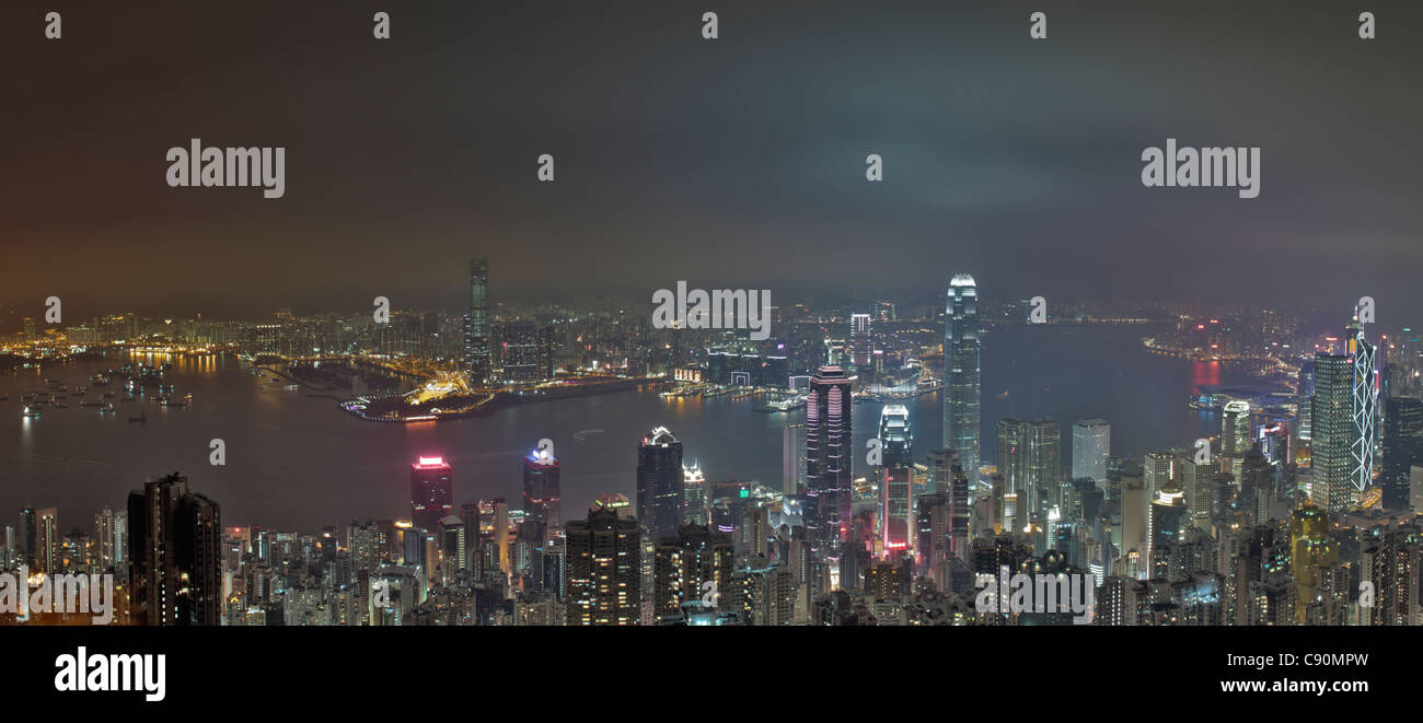 View of Hong Kong from Victoria Peak towards Victoria Harbour and the illuminated skyscrapers at night, Hong Kong, China Stock Photo