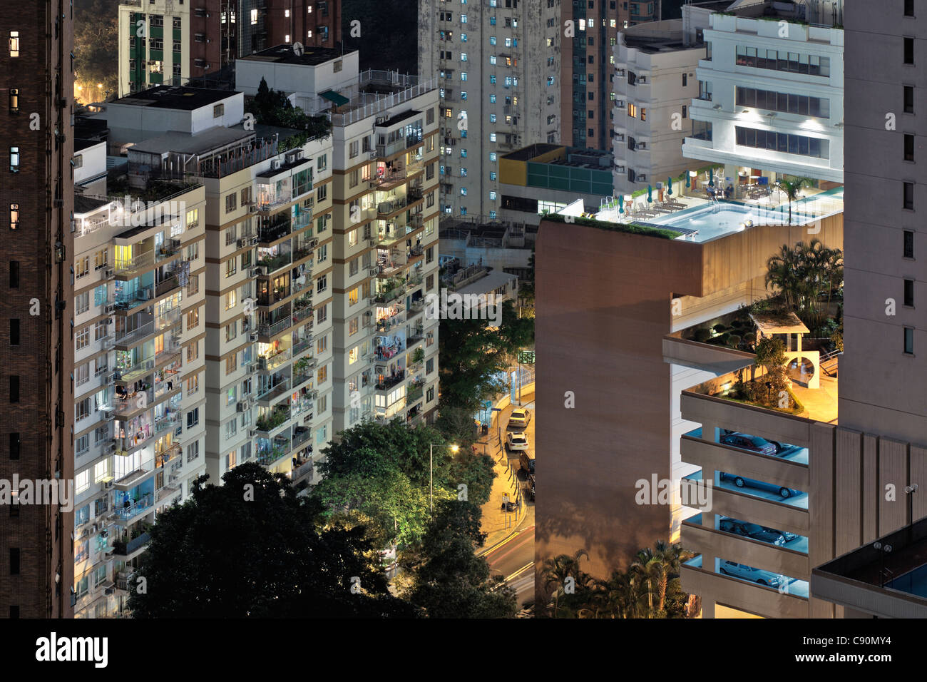 Hong Kong housing estate with swimming pool at night, Hong Kong, China Stock Photo