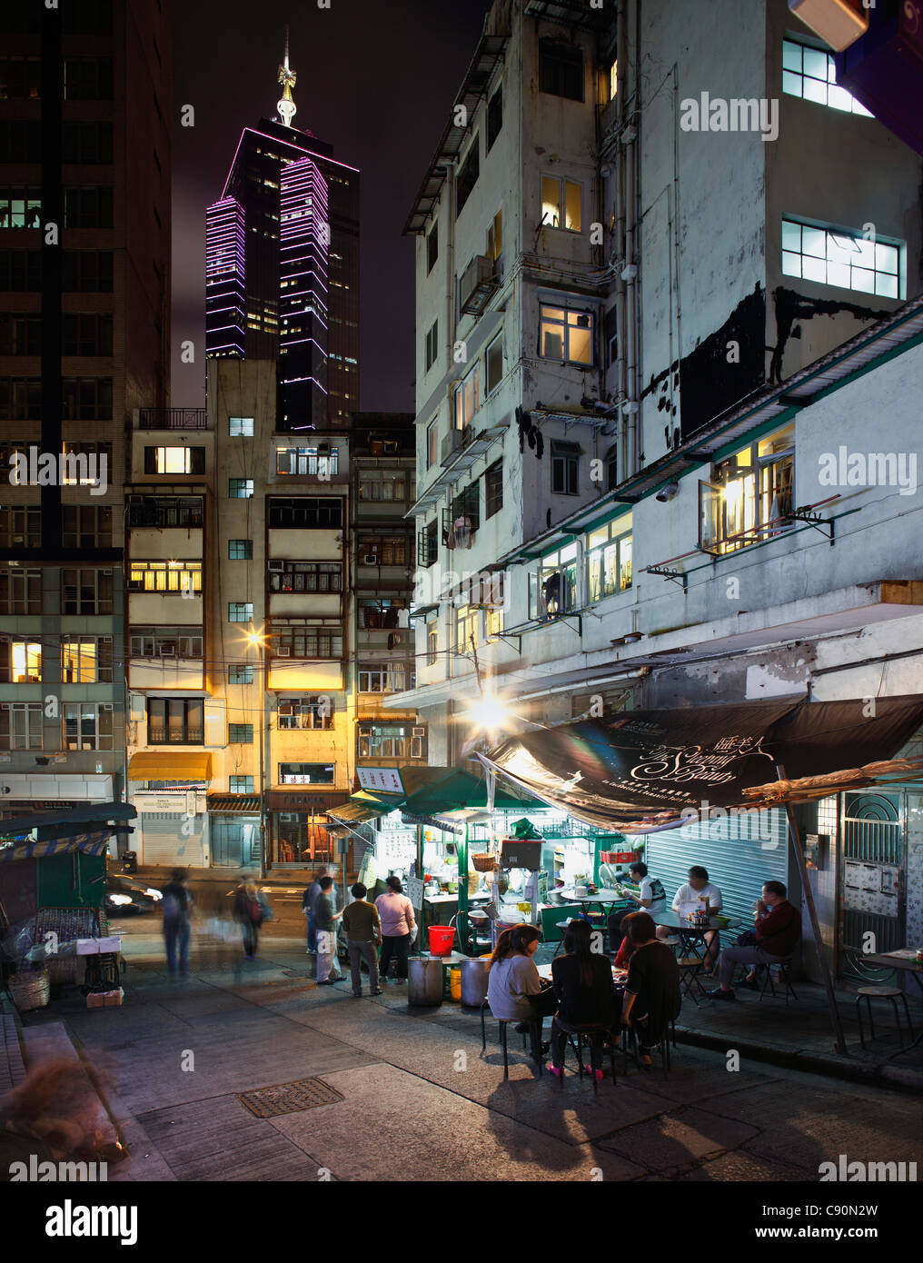 Cookshop in front of The Center, Central District at night, Hong Kong, China Stock Photo
