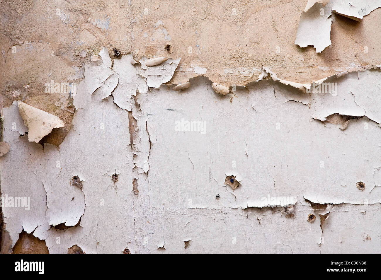Paint Peeling Off Plaster Wall In A Derelict Building Stock Photo