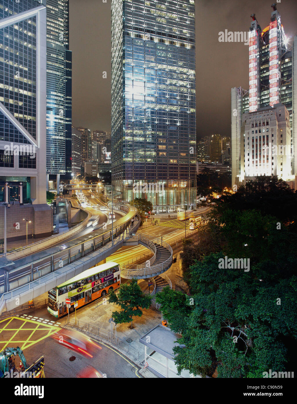 Double-decker bus, Bank of China (l), Cheung Kong Centre (c), HSBC headquarters (r), Queensway, Garden Road at night, Hong Kong, Stock Photo