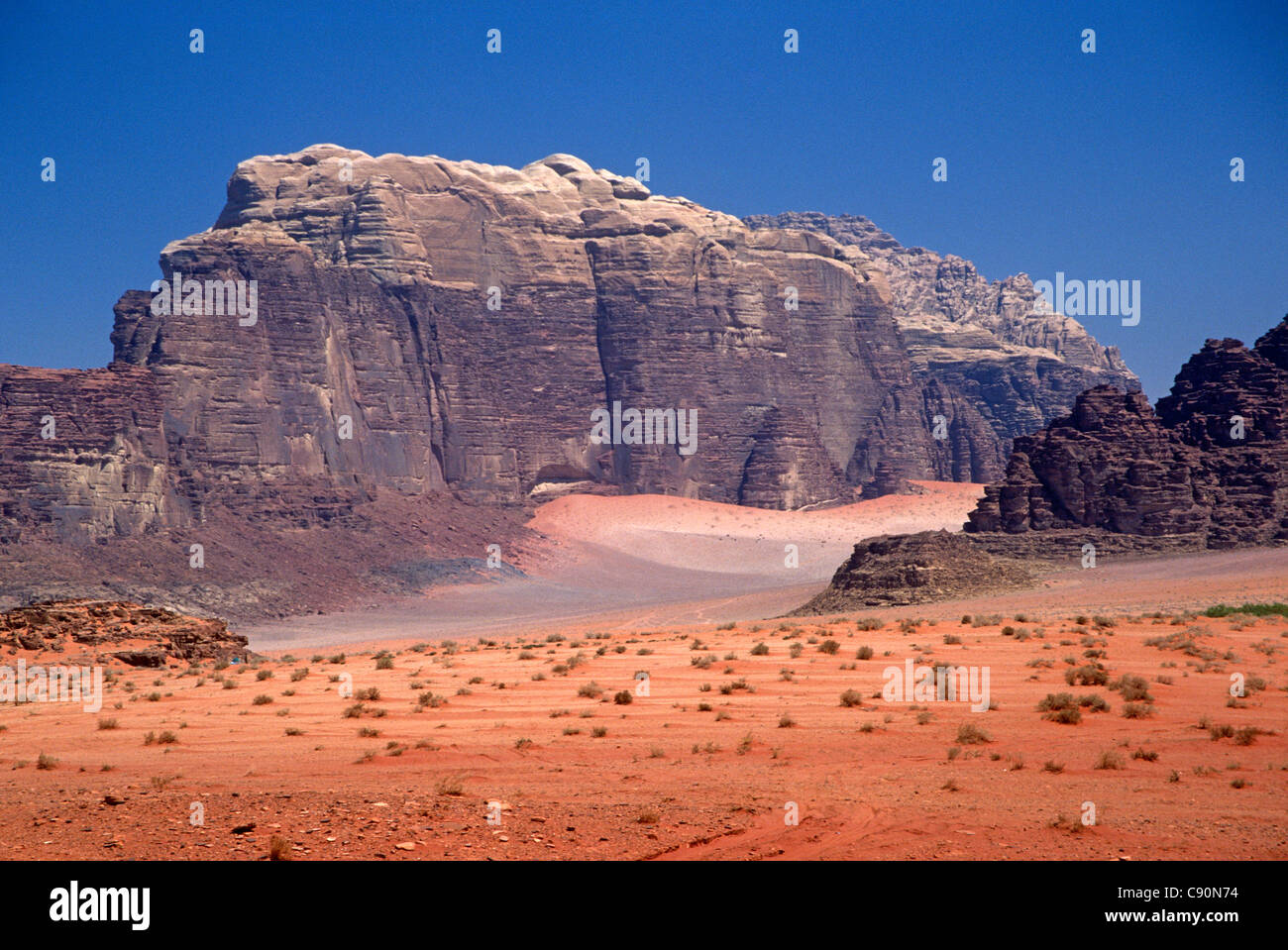 The Wadi Rum is a valley surrounded by large rock jebels which are popular with climbers and the canyons such as Kharazeh are Stock Photo