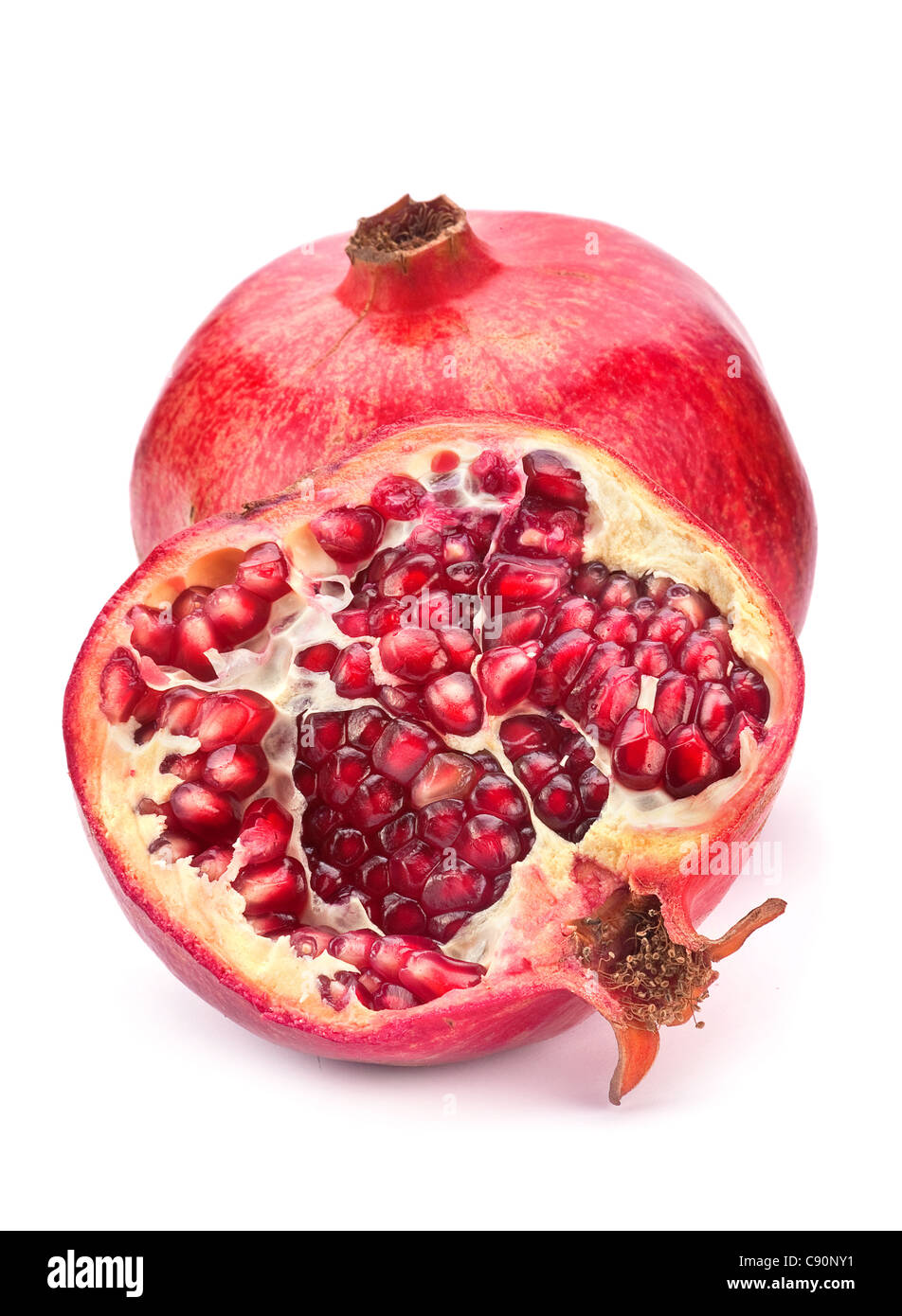 Red pomegranate fruit closeup on white background Stock Photo
