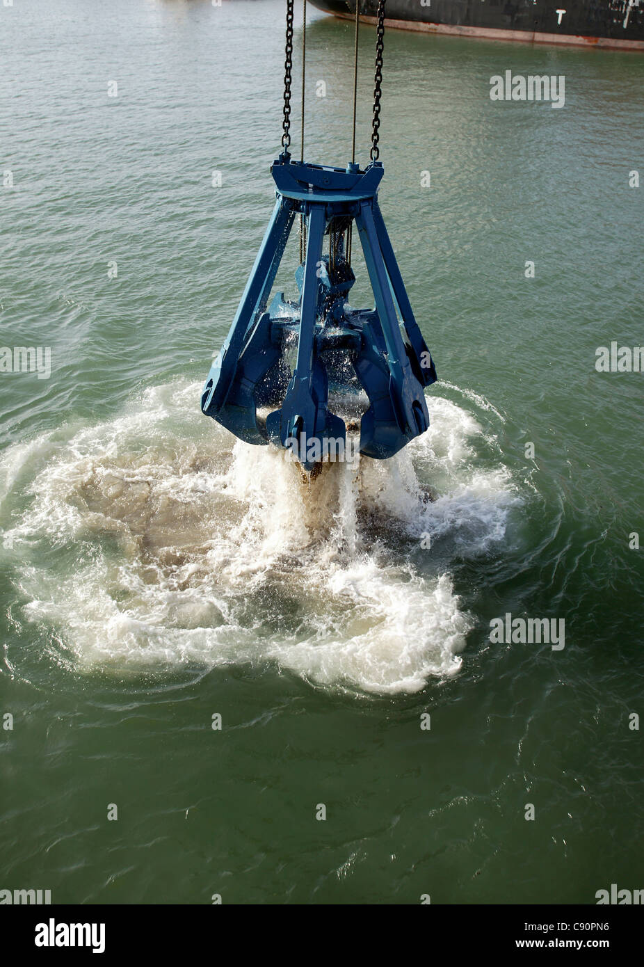 Heavy duty bucket of the dredging platform Stock Photo Alamy