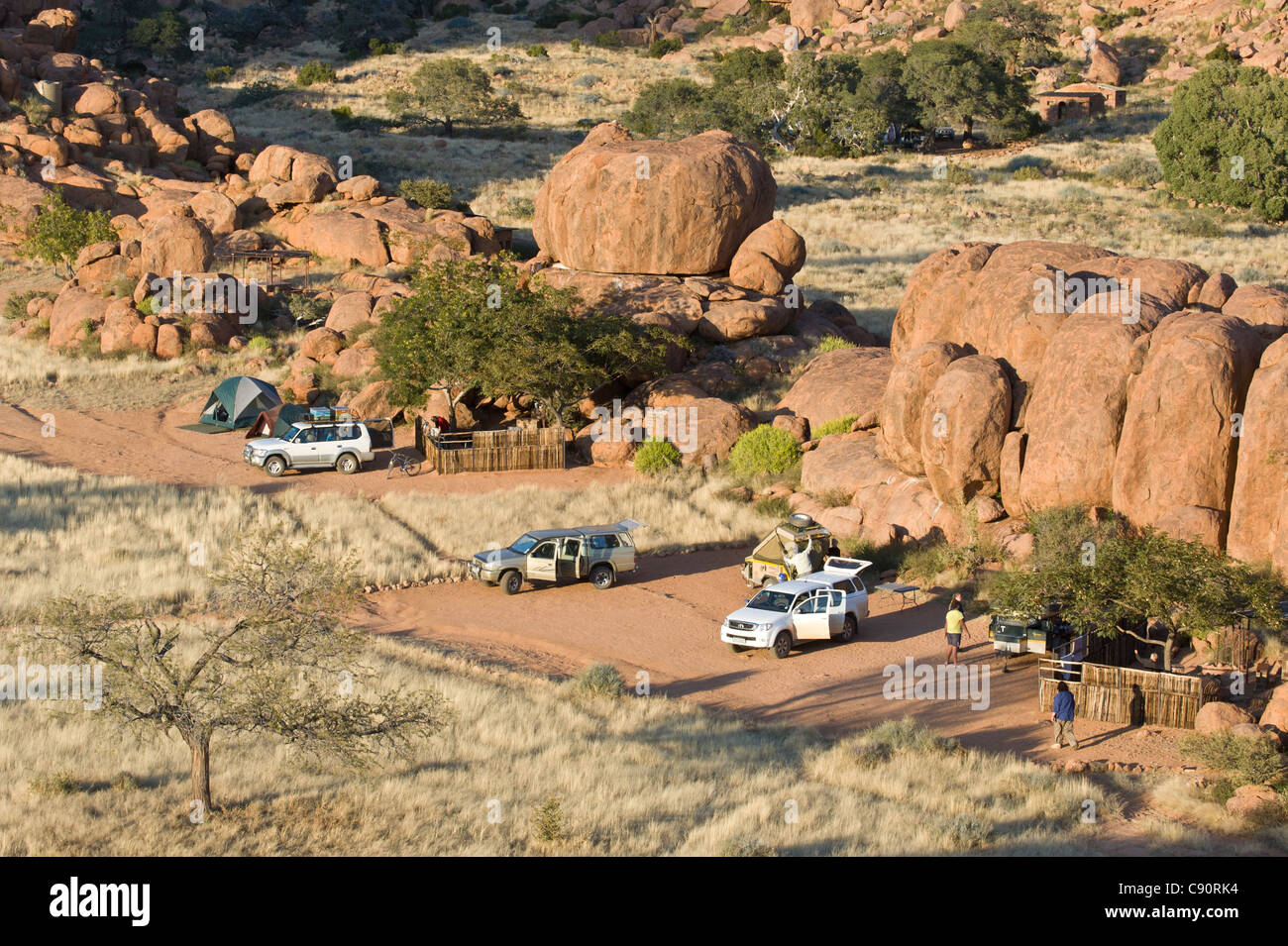 Campsite and vehicles on Koiimasis farm Tiras Mountains Namibia Stock Photo