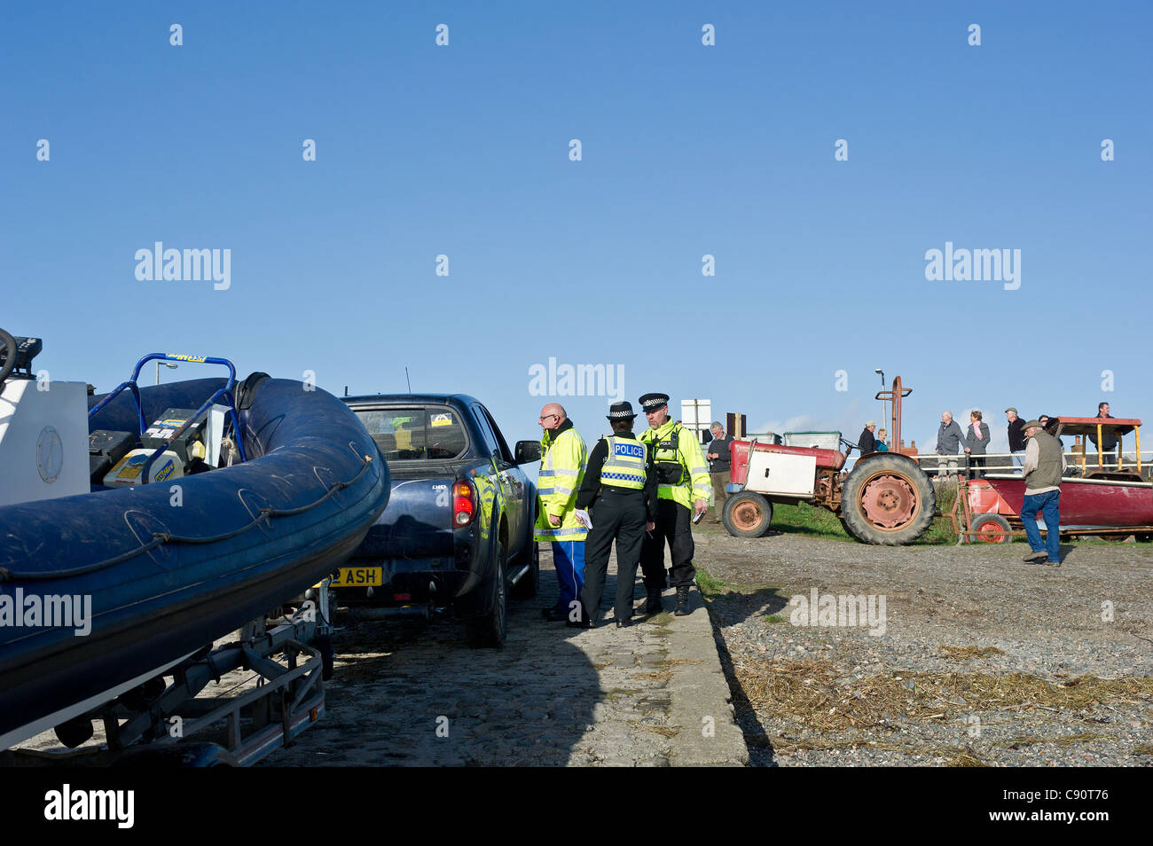 Police from the Lancashire Constabulary checking on cocklers permits Stock Photo