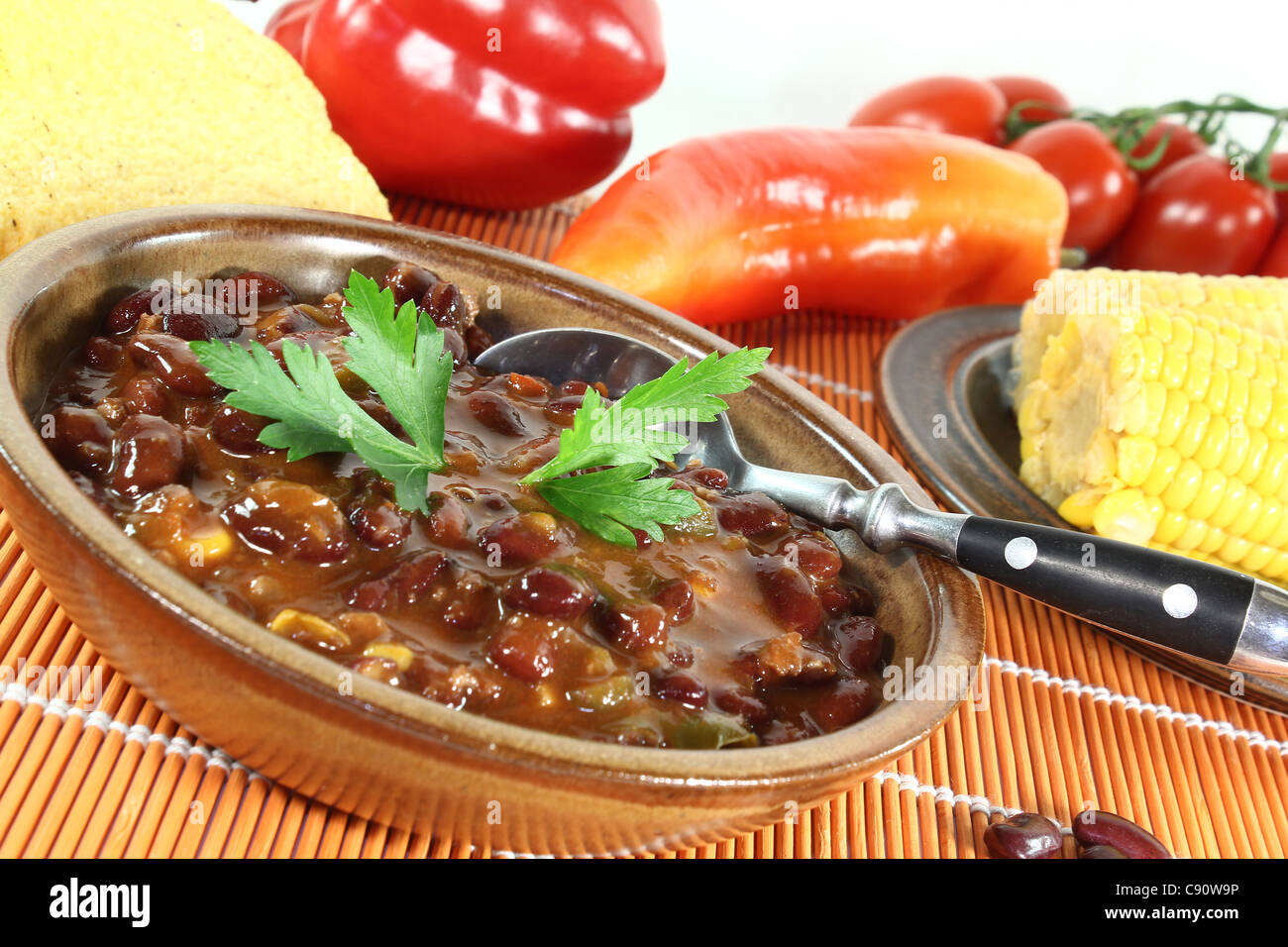 Chili con carne with kidney beans, beef, peppers and parsley Stock