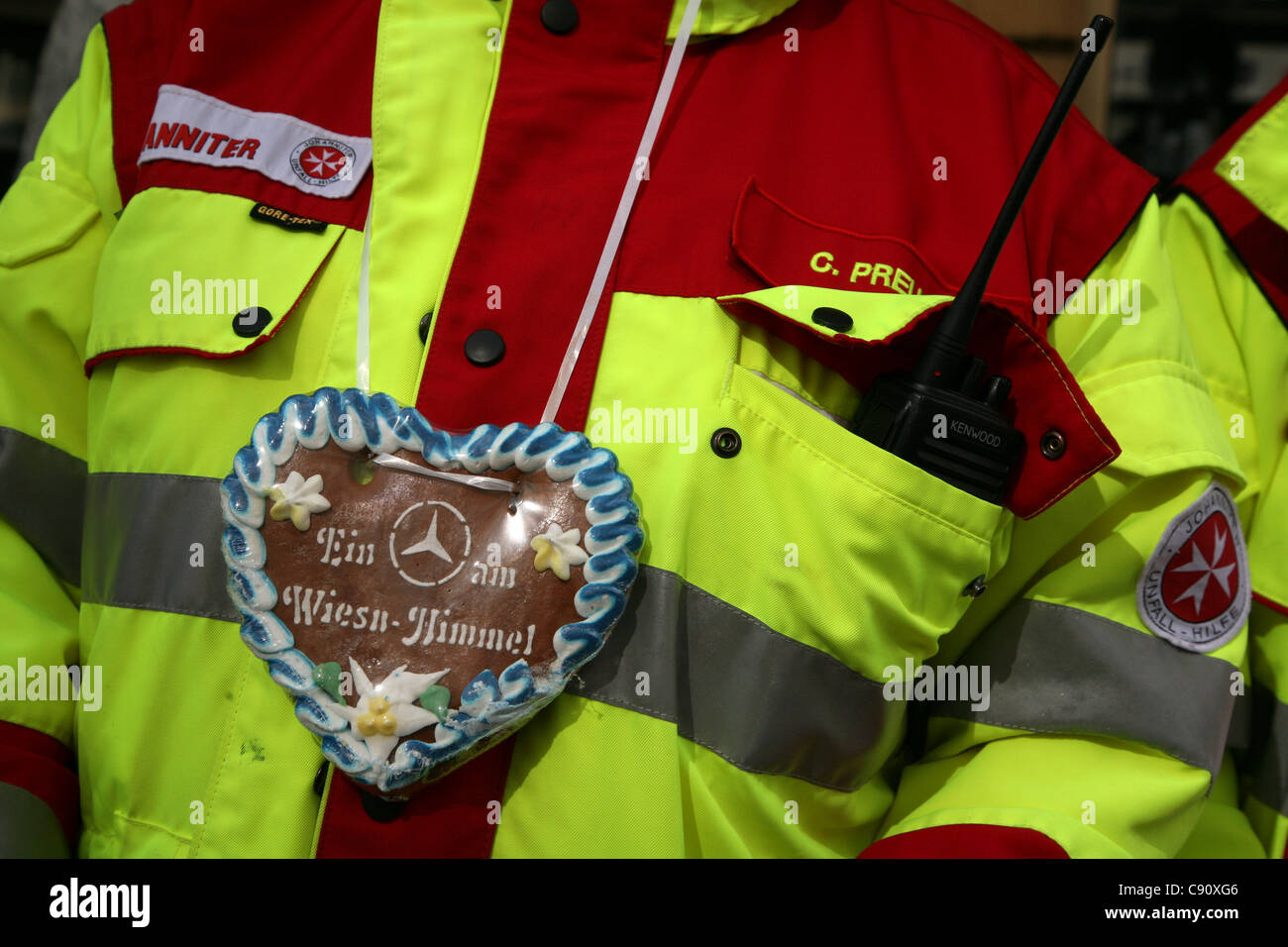 Accident assistant uniform decorated with a gingerbread heart at the Oktoberfest Beer Festival in Munich, Germany. Stock Photo
