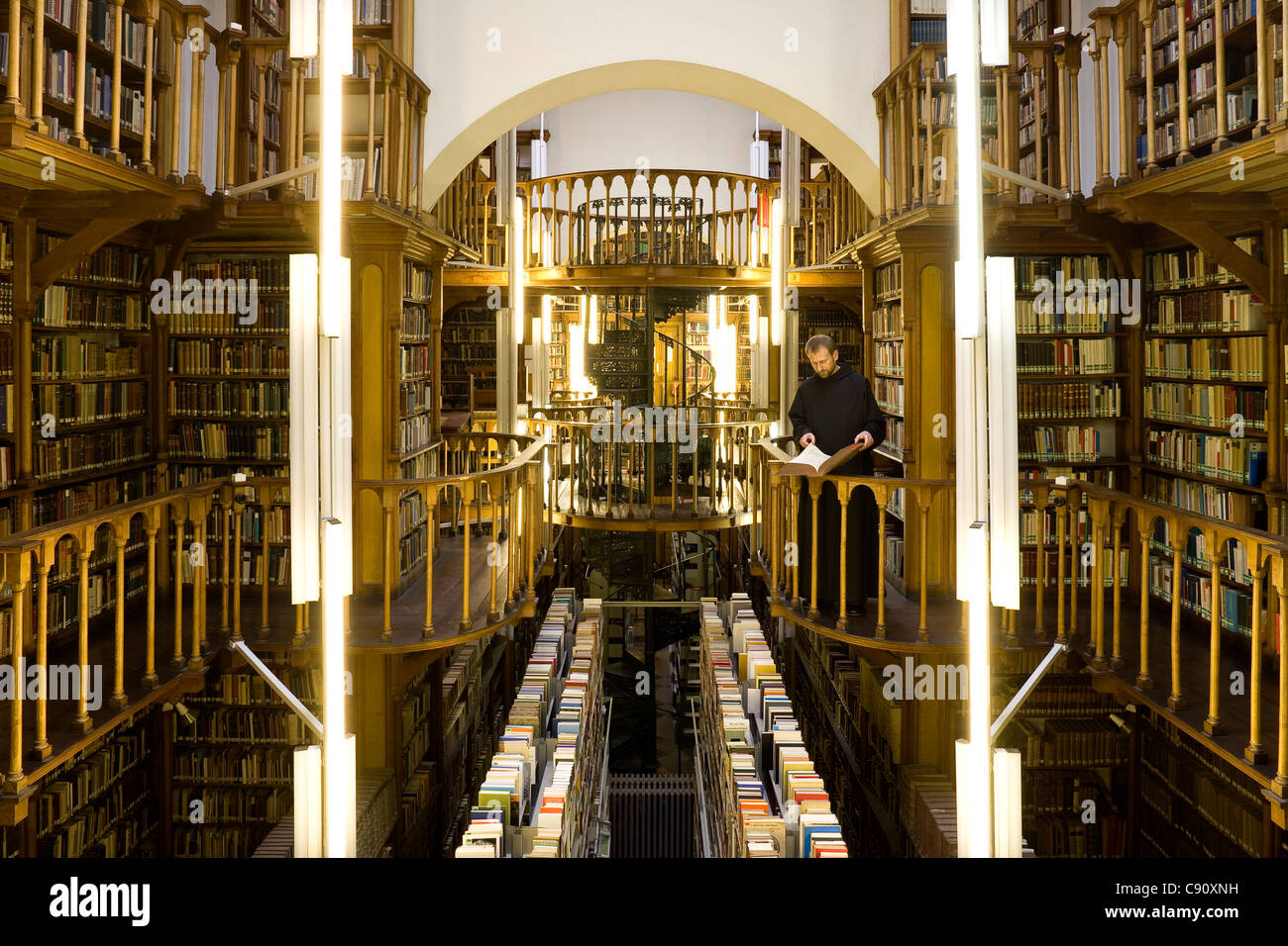 Monk at the library at Maria Laach abbey, Eifel, Rhineland-Palatinate, Germany, Europe Stock Photo