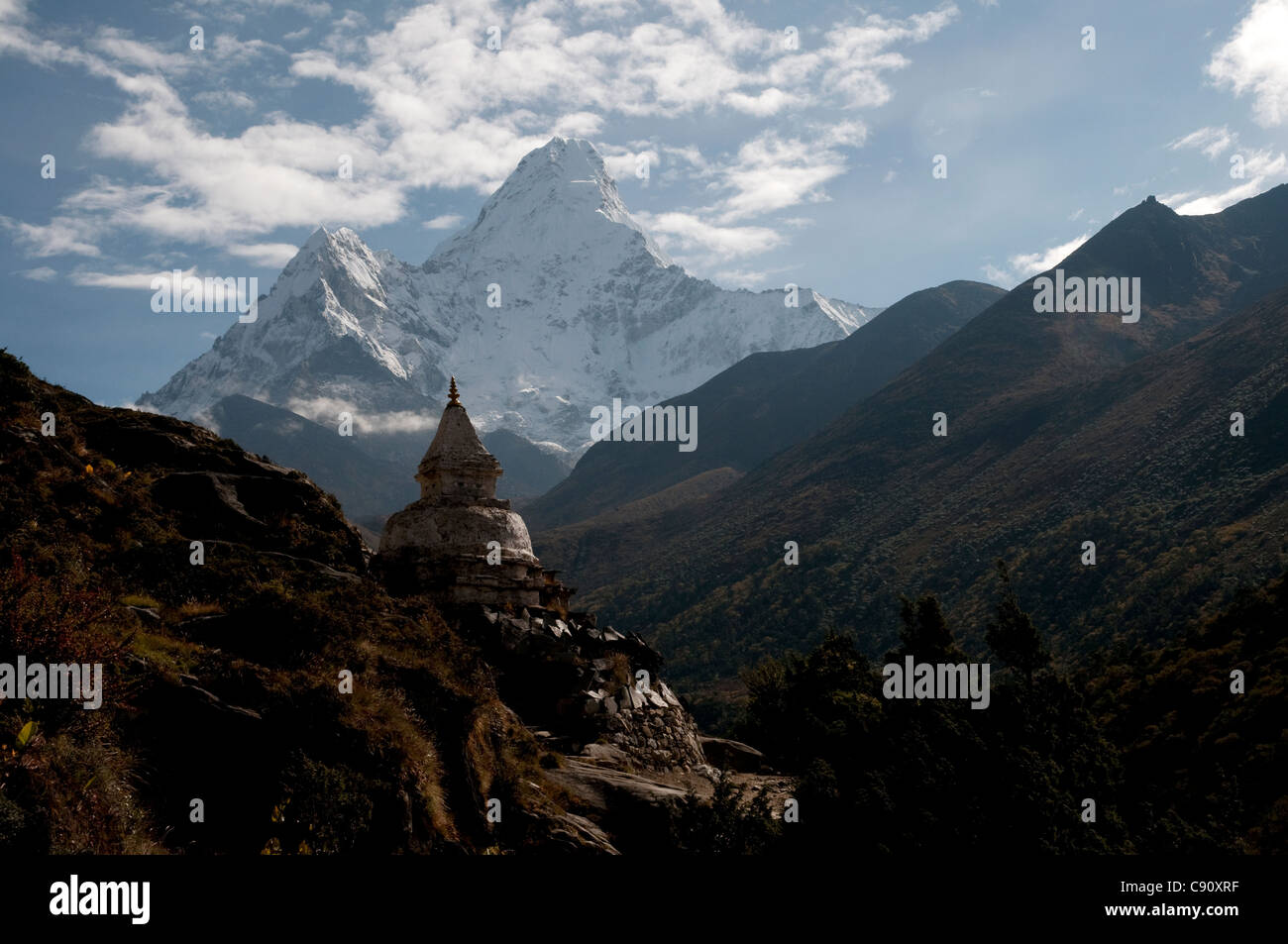 Ama Dablam is one of the huge sharp Himalayan peaks that rise above the route to Everest Base Camp through the valleys of the Stock Photo