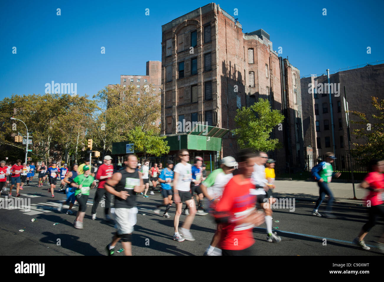 Runners race down Fifth Avenue through Harlem in the 42nd Annual ING