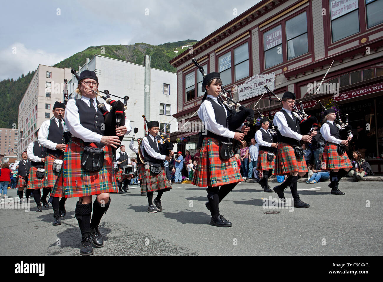 Band of pipers marching on the 4th July parade. Juneau. Alaska. USA Stock Photo