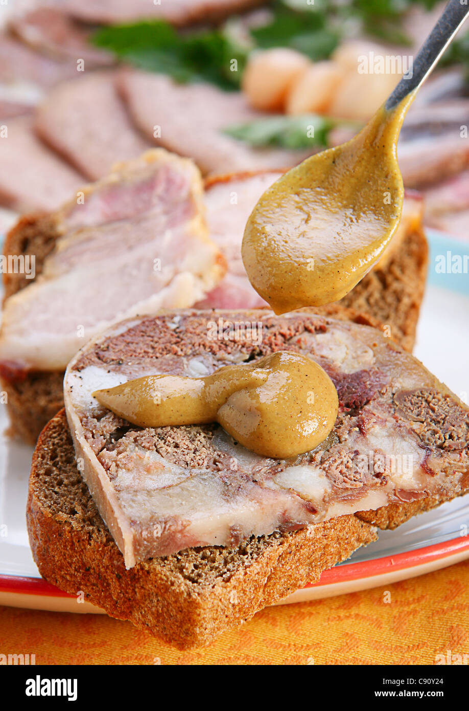 Sandwich with meat roll and mustard Stock Photo