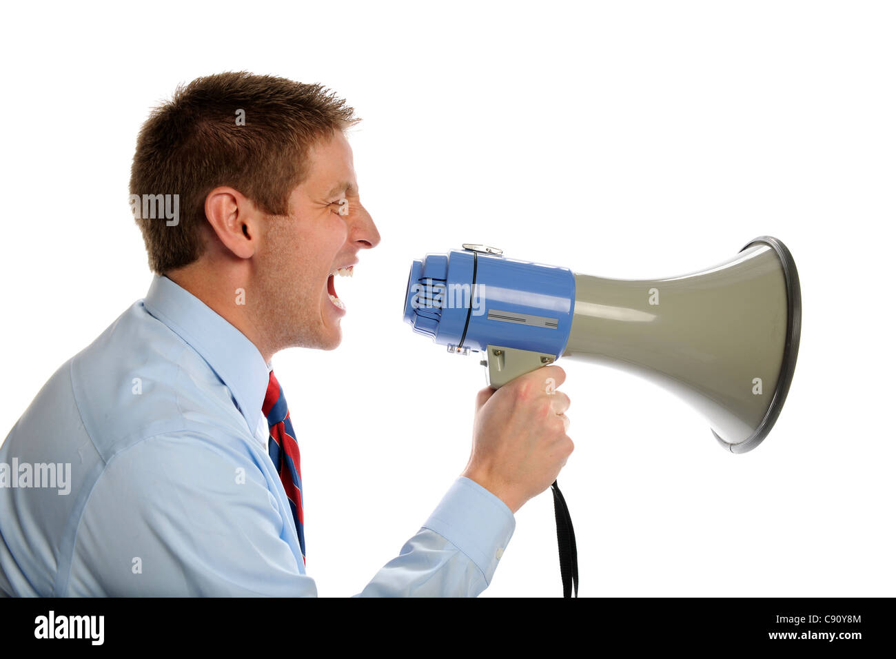 Young businessman using megaphone isolated over white background Stock ...