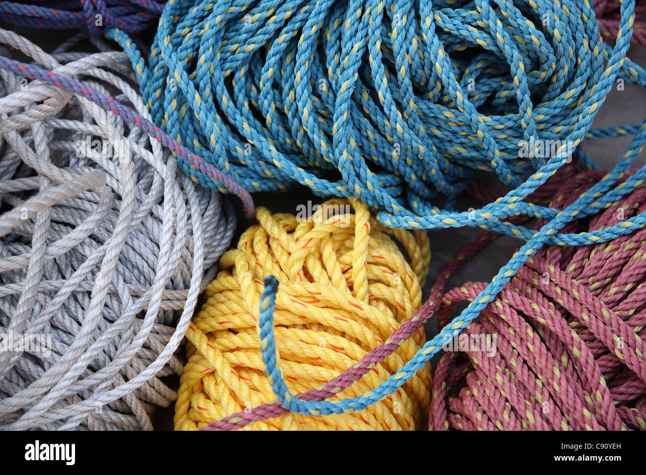 there is a long history of growing jute plants and manaufacture of rope in India. Rope can be dyed many colours. Stock Photo