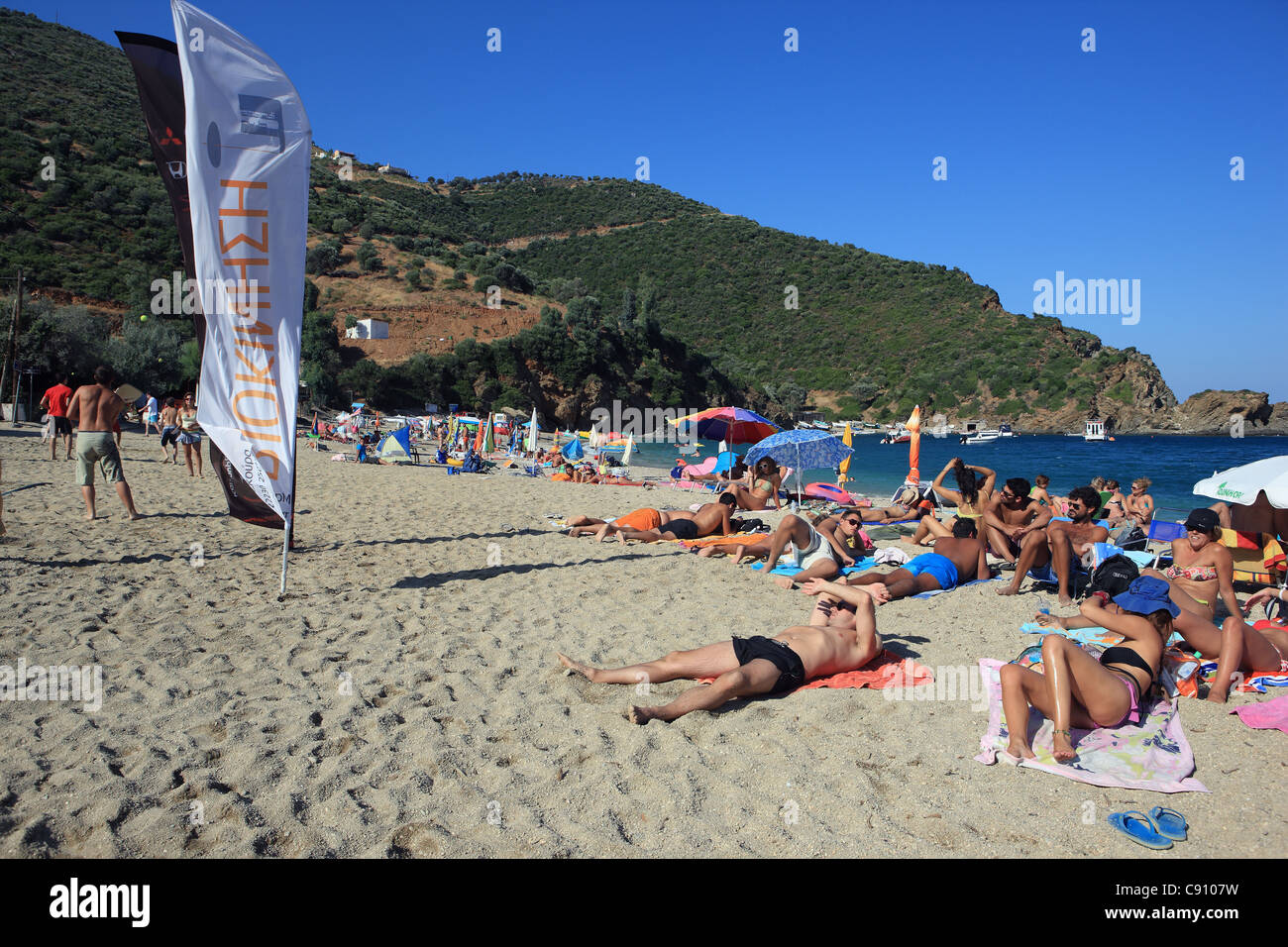 Busy beach in Kalamos on the Greek island of Evia Stock Photo