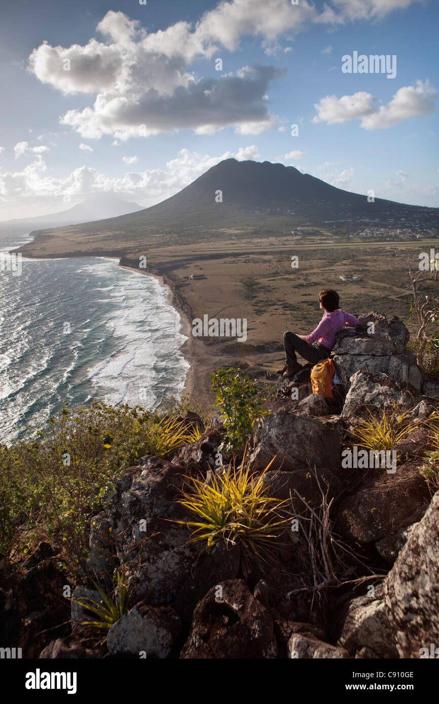The Netherlands, Oranjestad, Sint Eustatius Island, Dutch Caribbean. Gilboa Hill on airstrip, The Quill. Woman, taking rest. Stock Photo