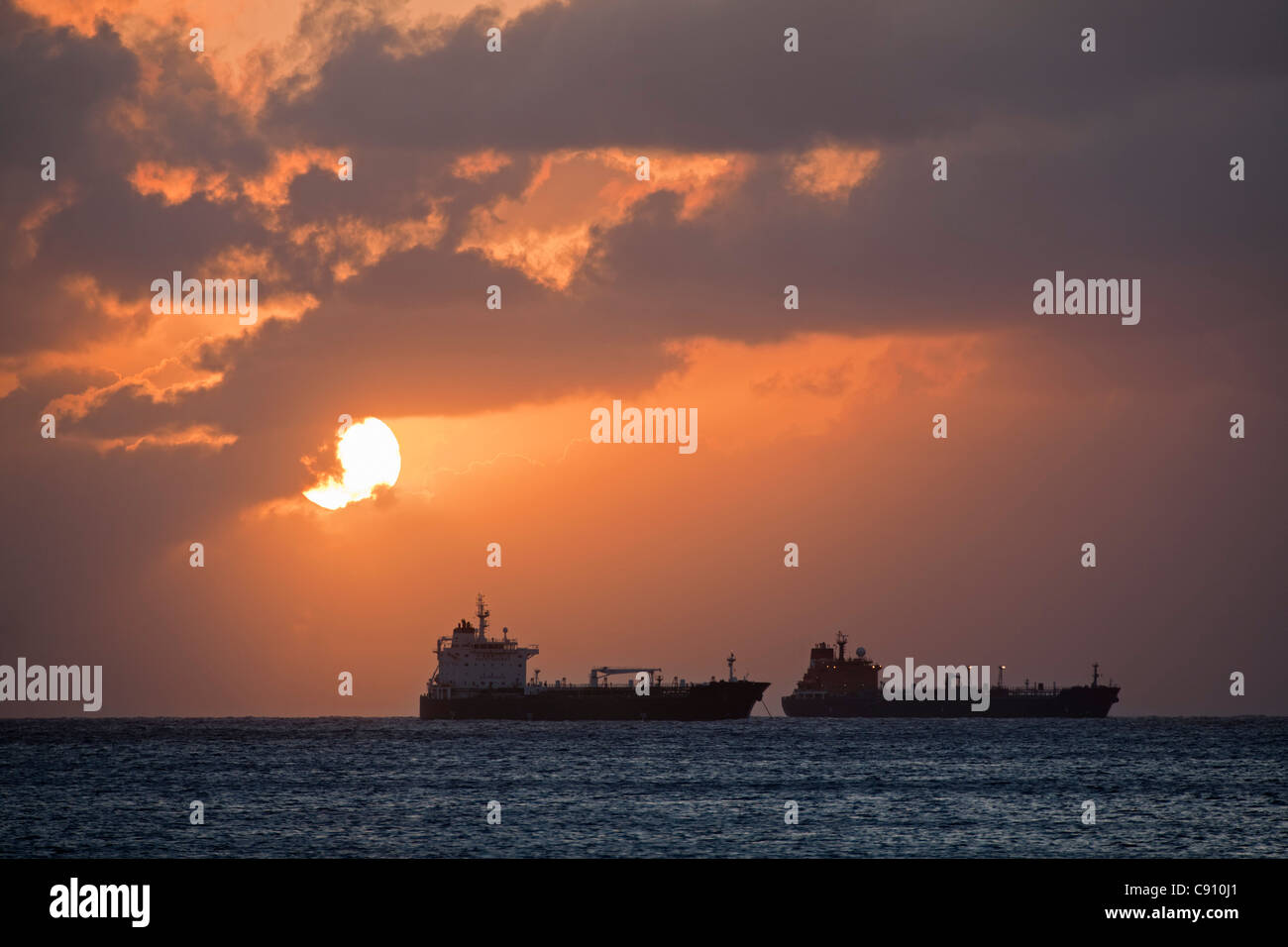 The Netherlands, Oranjestad, Sint Eustatius Island, Dutch Caribbean. Oil tankers. Sunset. Stock Photo