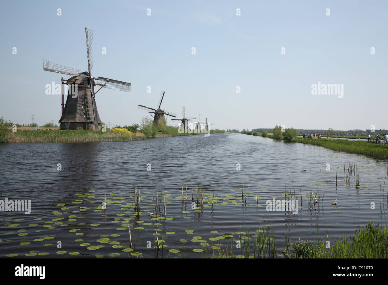 The windmills of Kinderdijk were built to pump water around the system of canals or polders. They are one of the best known Stock Photo