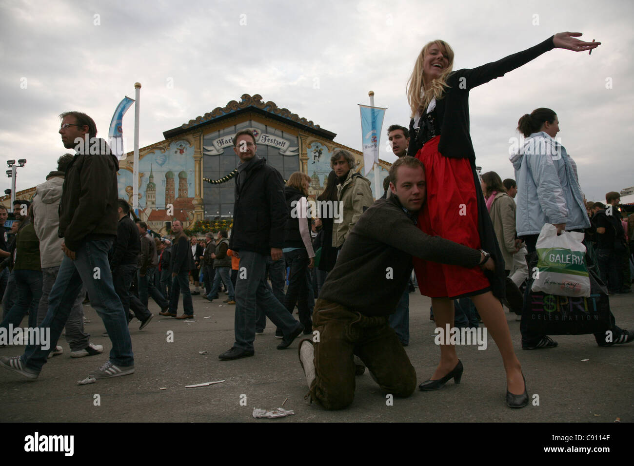 Public in front of the Hacker Festzelt on the first day of the Oktoberfest Beer Festival in Munich, Germany. Stock Photo