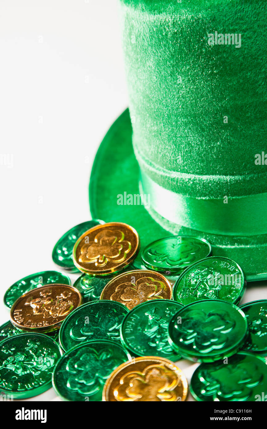 Gold and green coins with irish shamrock symbol Stock Photo