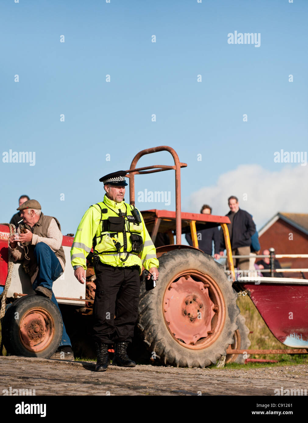 Police from the Lancashire Constabulary conducting a spot check on cocklers permits Stock Photo