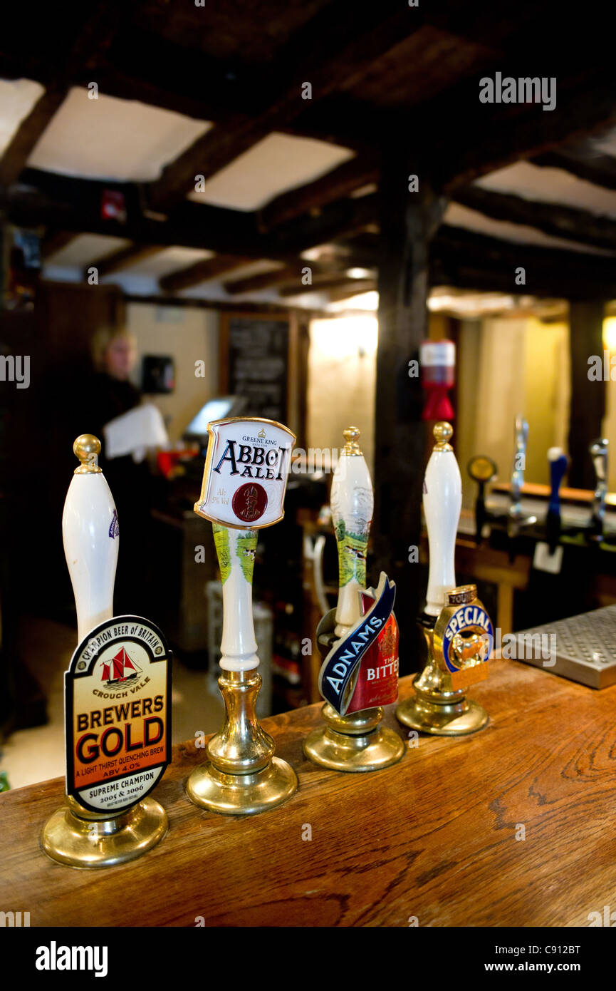 Beer handles on the bar of The Hoop Public House in Essex Stock Photo