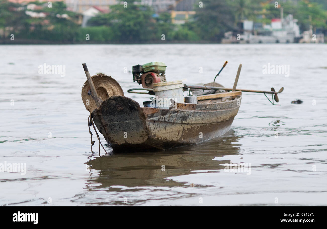 Old wooden boat on Saigon River in Ho Chi Minh City Stock Photo