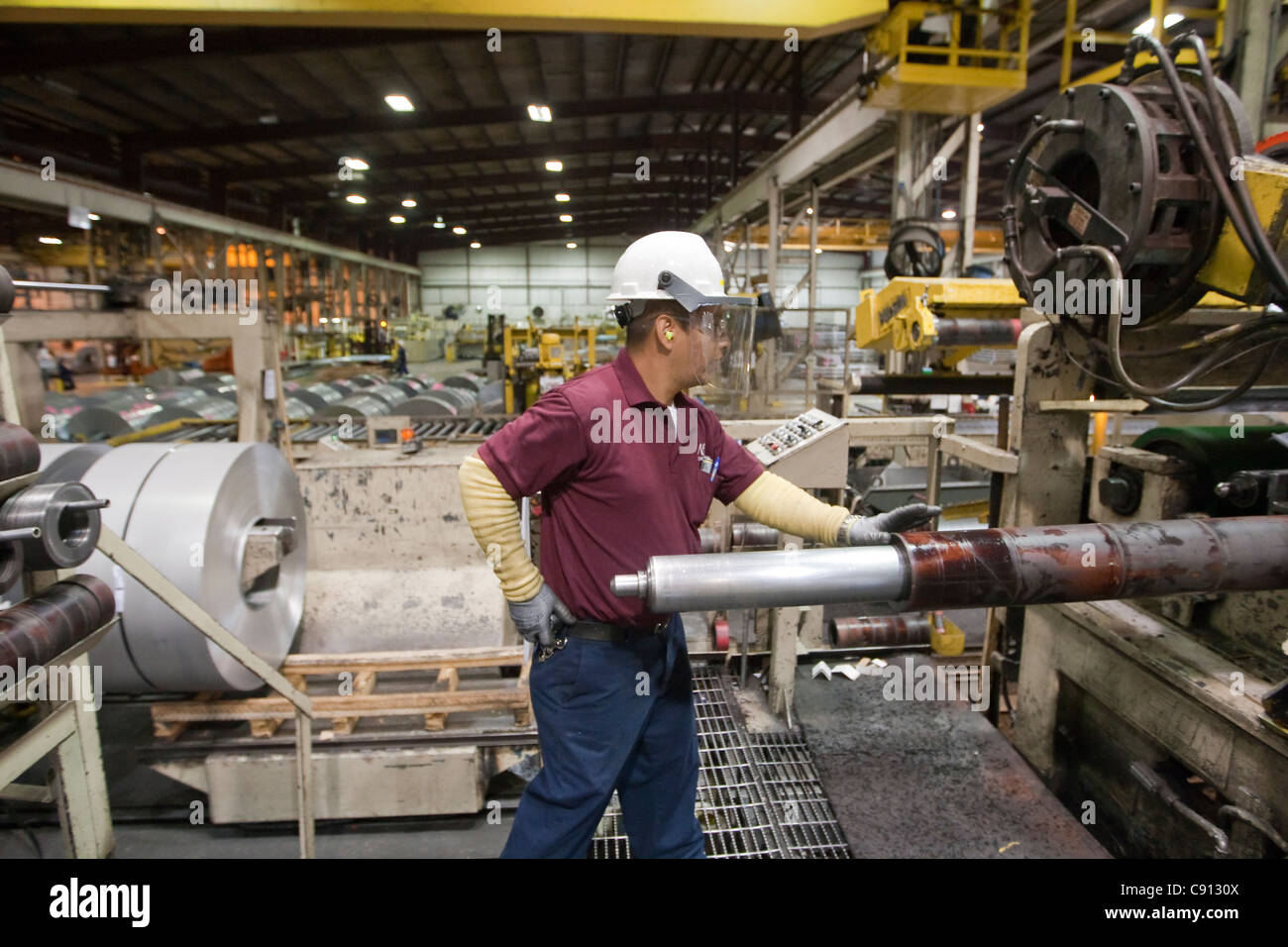 Hispanic male working at steel processing facility in Houston, Texas