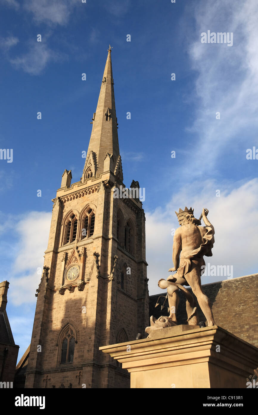 Statue of King Neptune and the spire of St Nicholas church, Market place, Durham city, north east England, UK Stock Photo