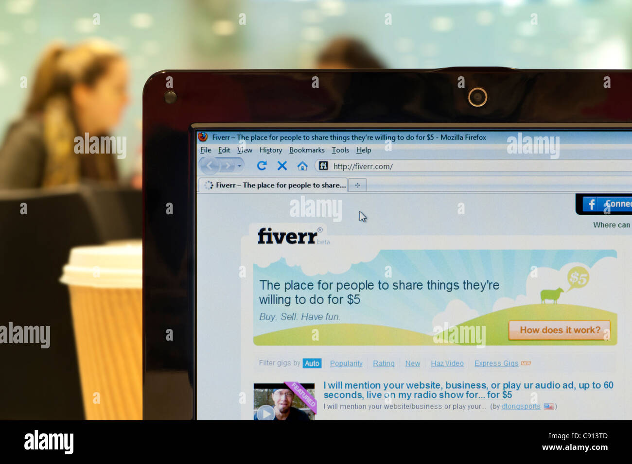 The Fiverr website shot in a coffee shop environment (Editorial use only: print, TV, e-book and editorial website). Stock Photo