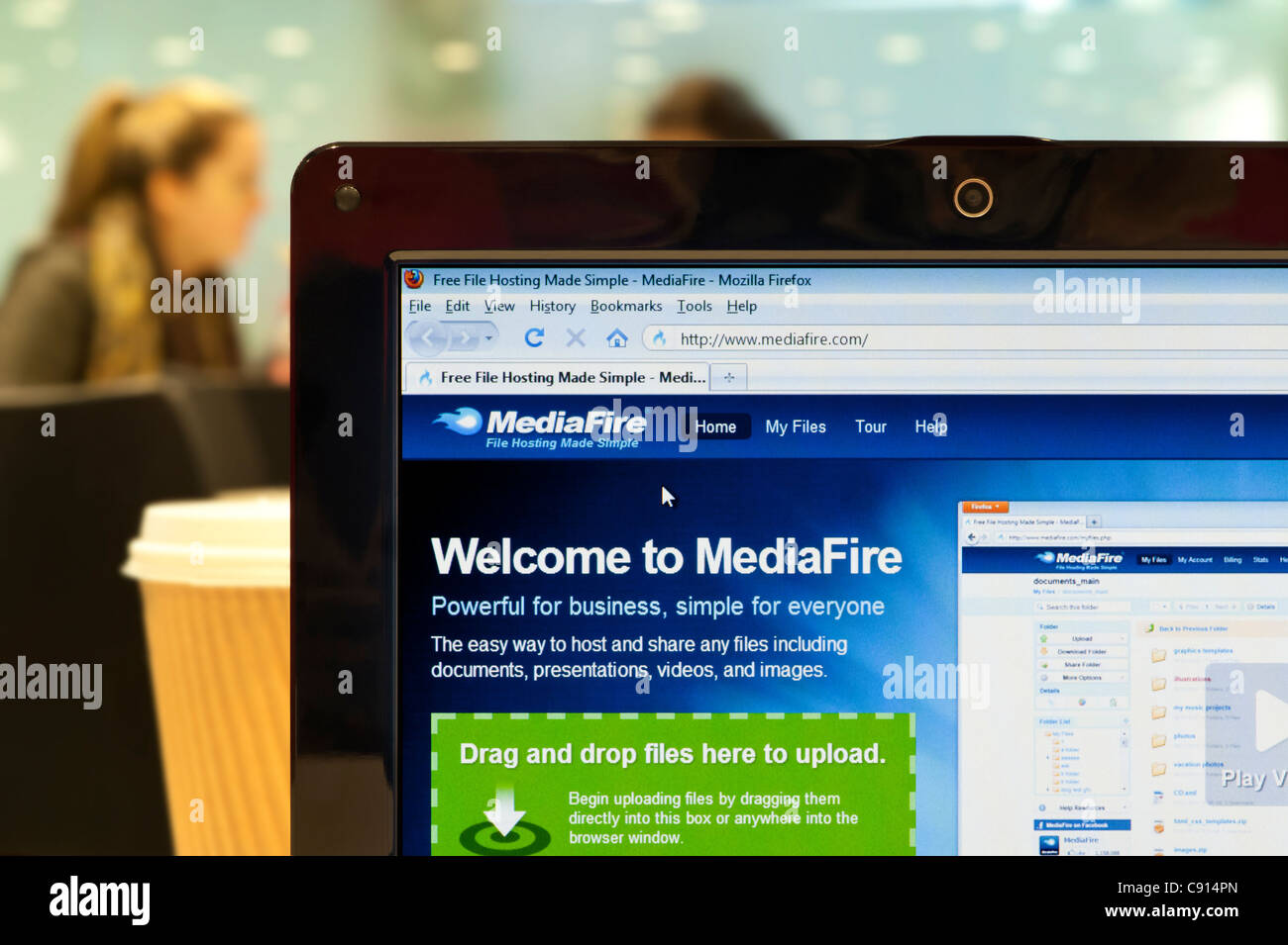 The MediaFire website shot in a coffee shop environment (Editorial use only: print, TV, e-book and editorial website). Stock Photo