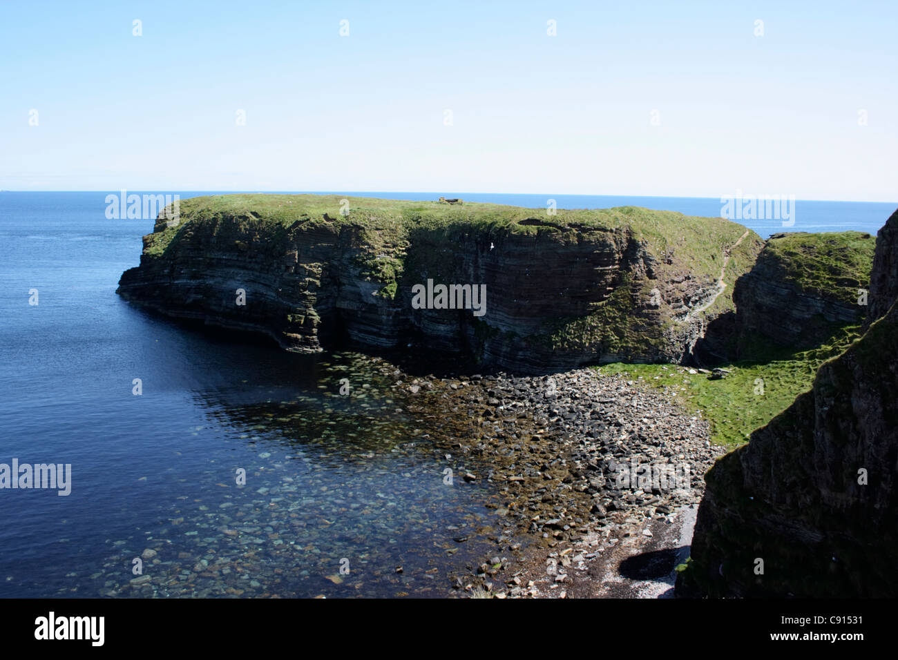 The Brough of Deerness is a Viking Age site perched on the top of a rock stack on the Deerness Peninsula in Orkney. Stock Photo