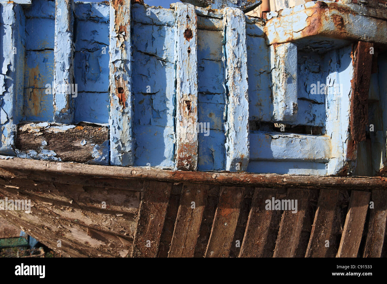 Detail view of peeling paint on old fishing boat on The Stade, Hastings, East Sussex, UK Stock Photo