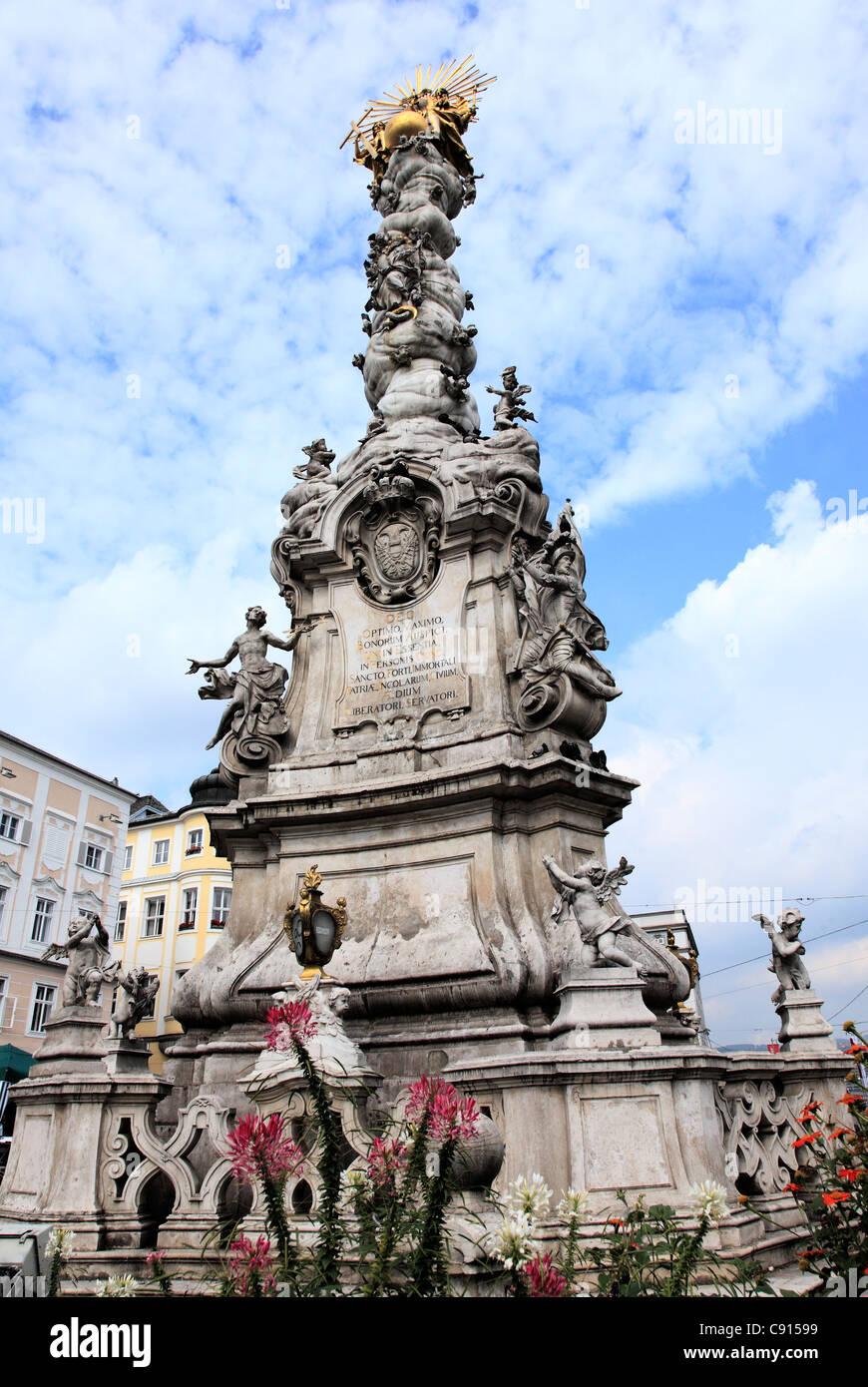 In the Hauptplatz there is an elaborate monument which towers above the square, called the Holy Trinity Monument. Stock Photo