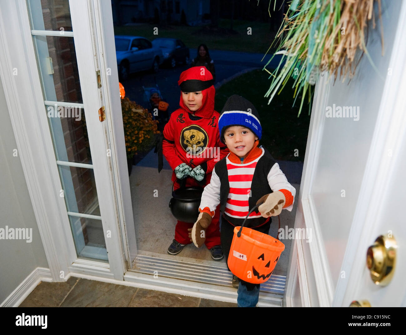 Canadian Children visiting house at Halloween night to collect candies Stock Photo
