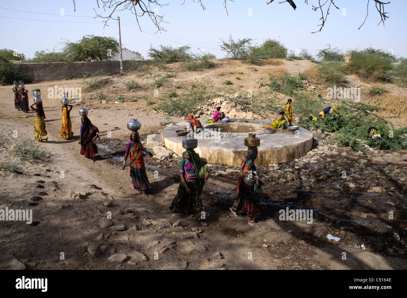 Villagers in Kutch collect water from the village well. Kutch, India. Stock Photo