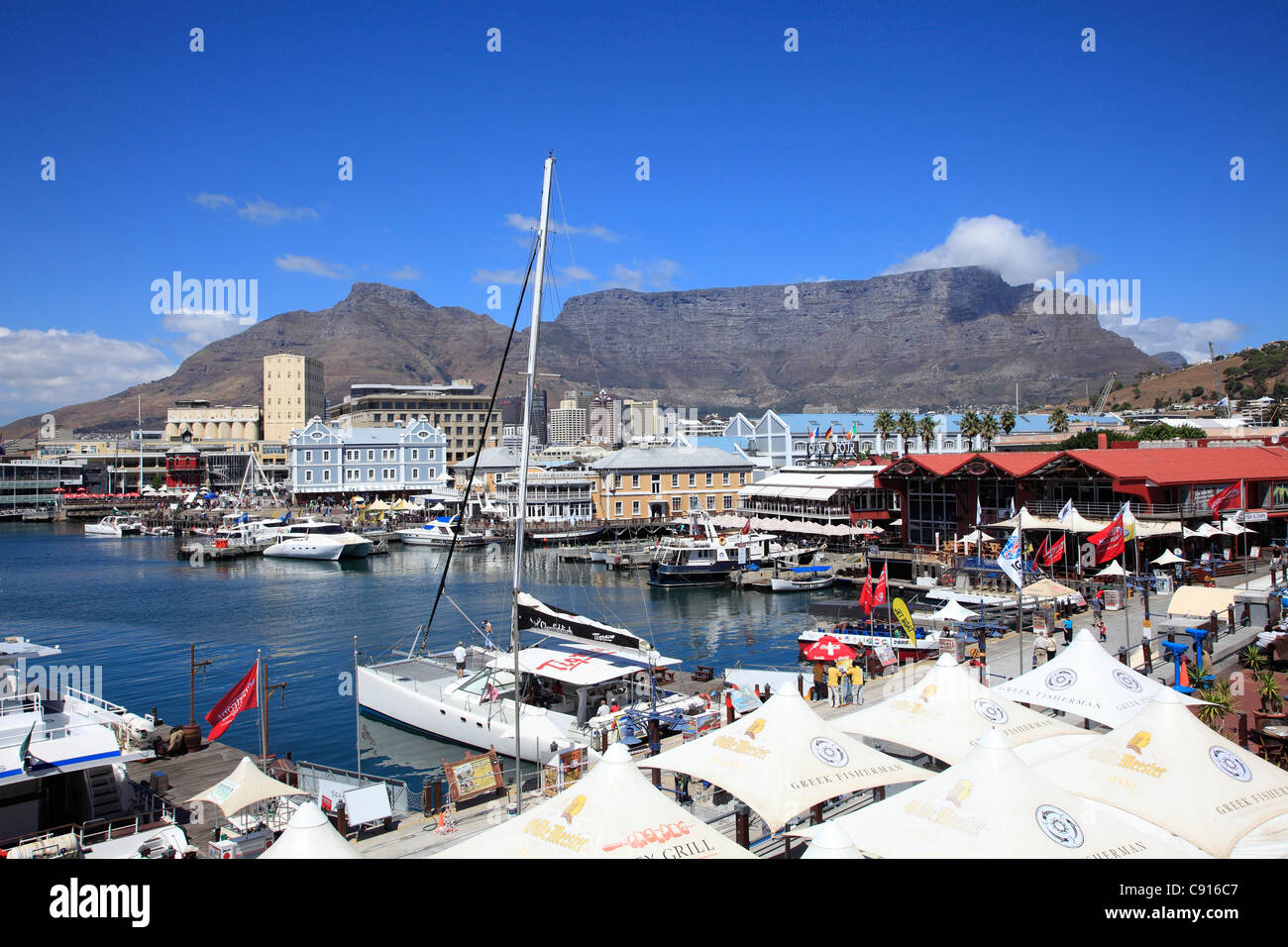 Table Mountain dominates the skyline over Cape Town, and is a stunning background to the cityscapes, and views of the harbour. Stock Photo