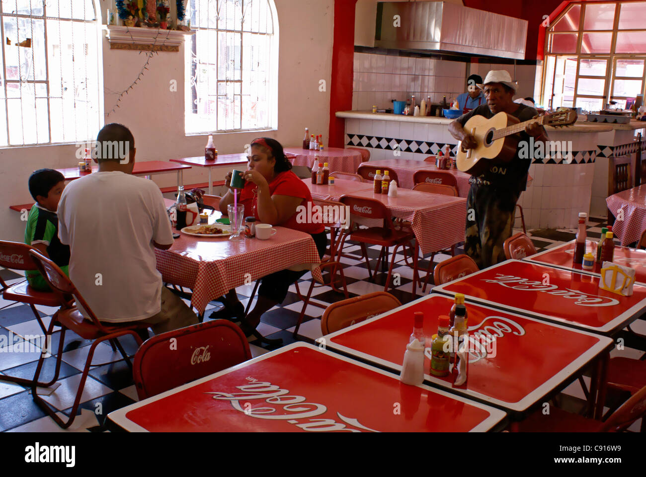 Guitar player singing in a traditional Mexican restaurant in the Mercado Pino Suarez market, Mazatlan, Sinaloa, Mexico Stock Photo
