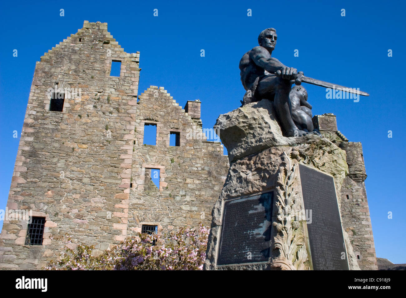In Kirkudbright there is a historic 16th century MacLellans castle,with a sculpture of a swordsman and inscriptions on a plaque Stock Photo