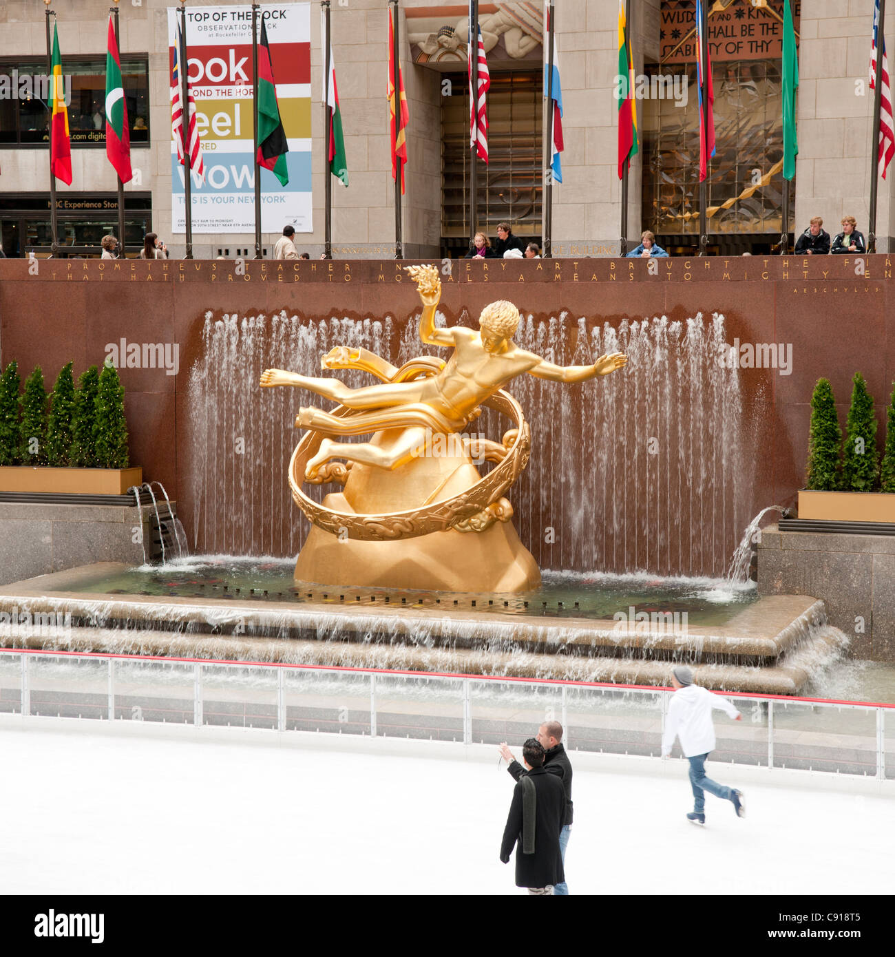 The Prometheus Statue by Paul Manship at Rockefeller Center in New York overlooks the ice skating rink at the centre outside Stock Photo