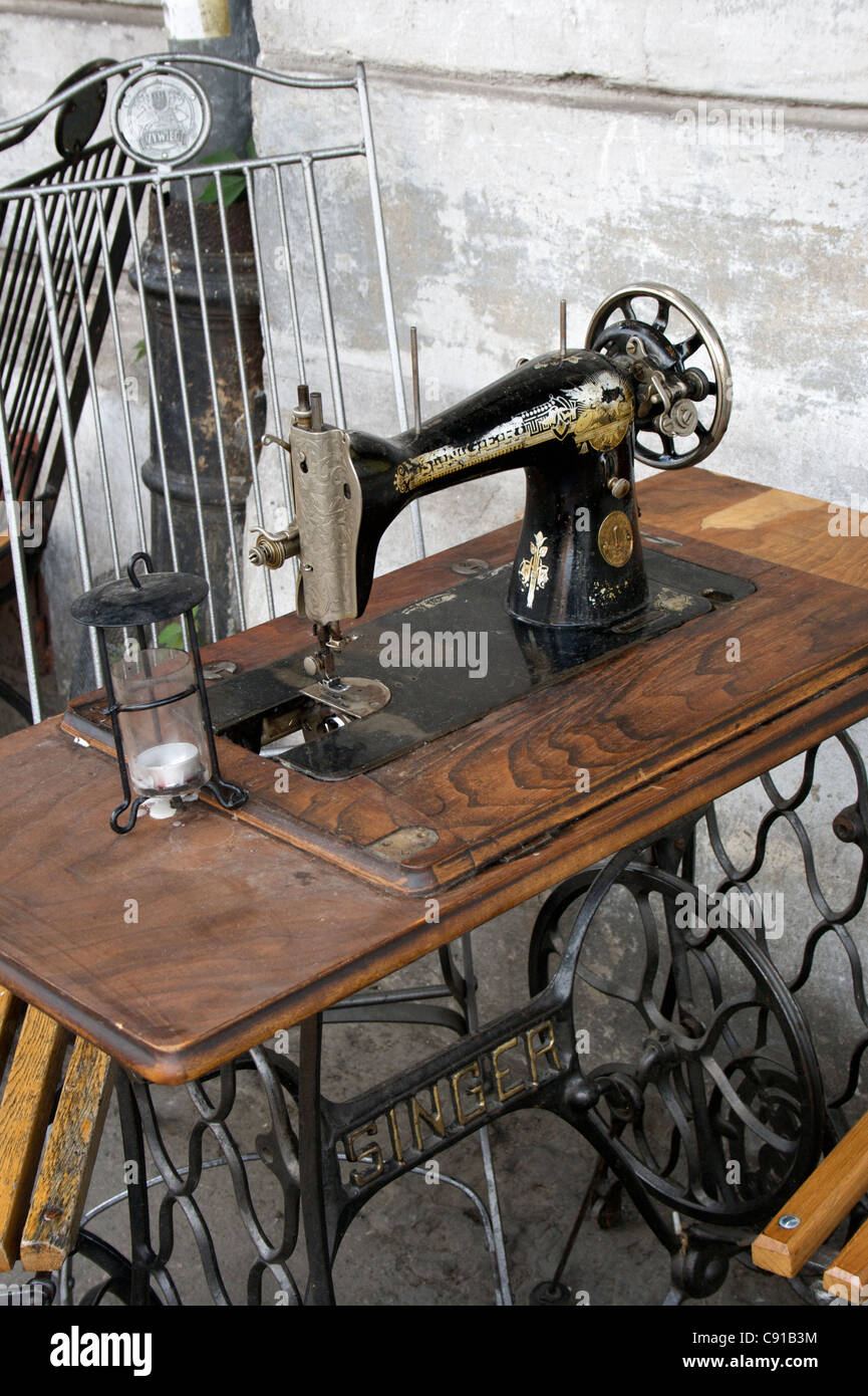 Outside tables at Cafe Singer with Singer sewing machine and slatted