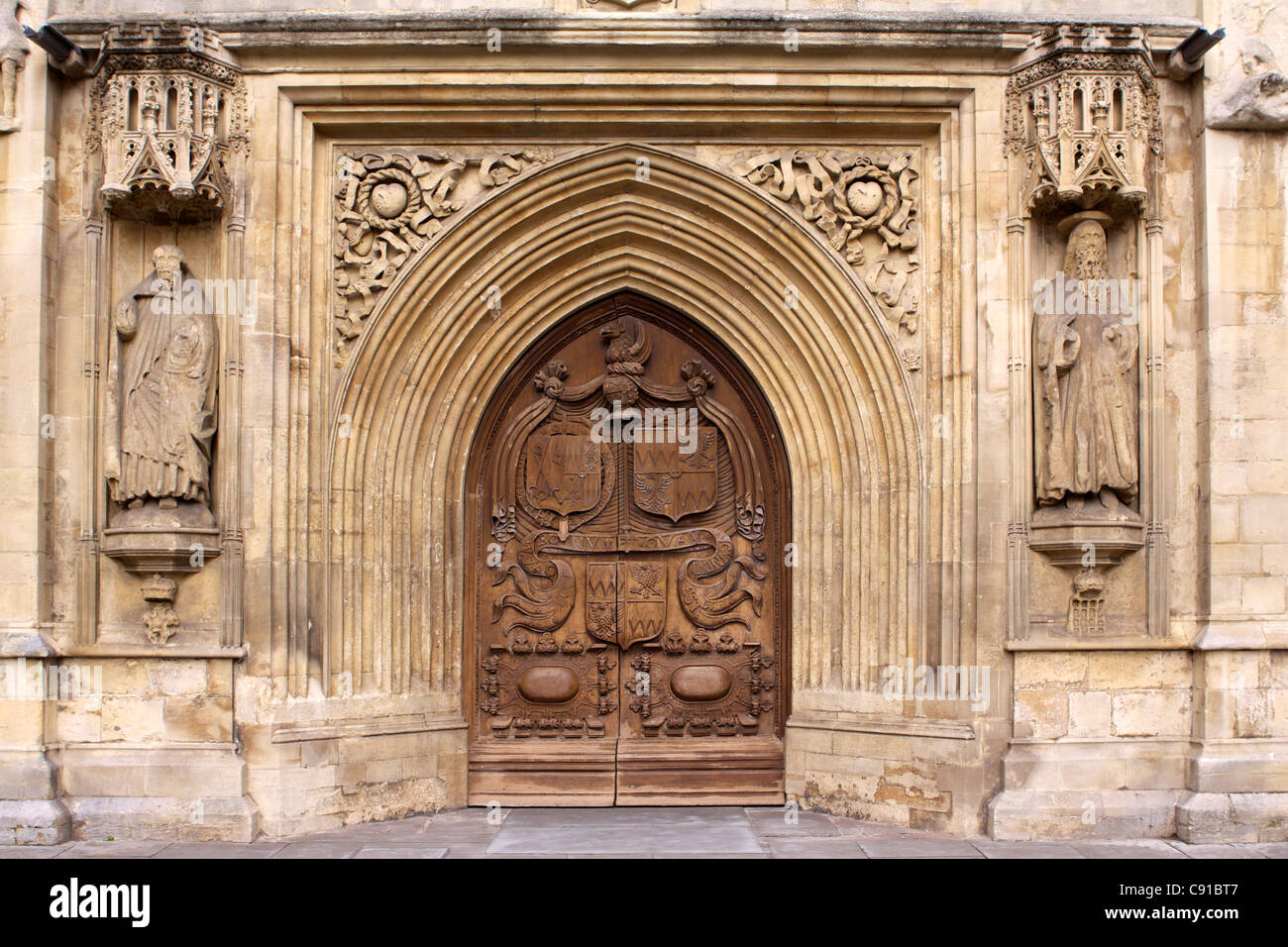 Wooden door and entrance to the Abbey Church of Saint Peter and Saint Paul, commonly known as Bath Abbey. Stock Photo