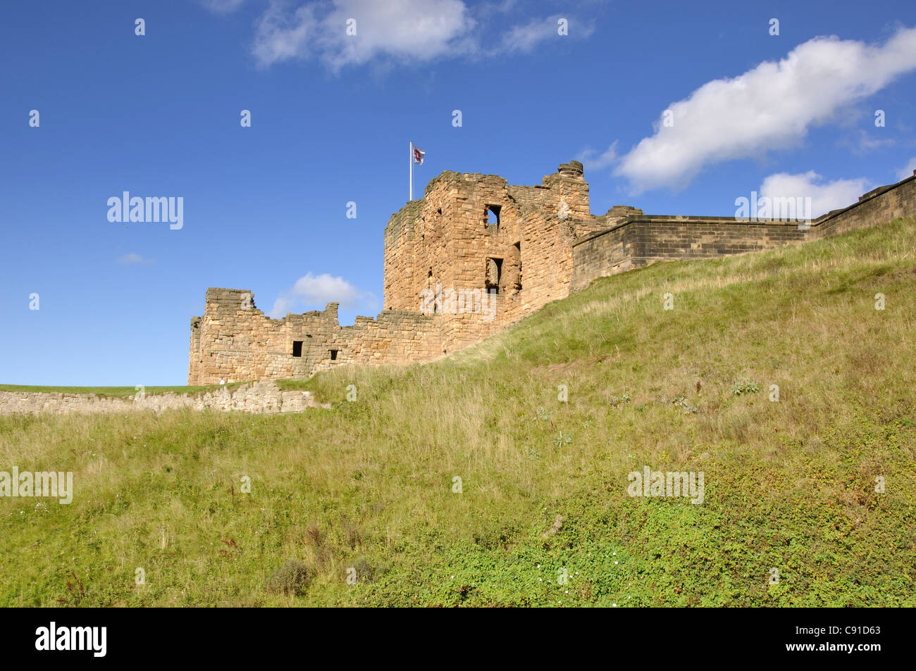 Tynemouth Castle is on a rocky headland (known as Pen Bal Crag) overlooking Tynemouth Pier and beach. The castle dates from the Stock Photo