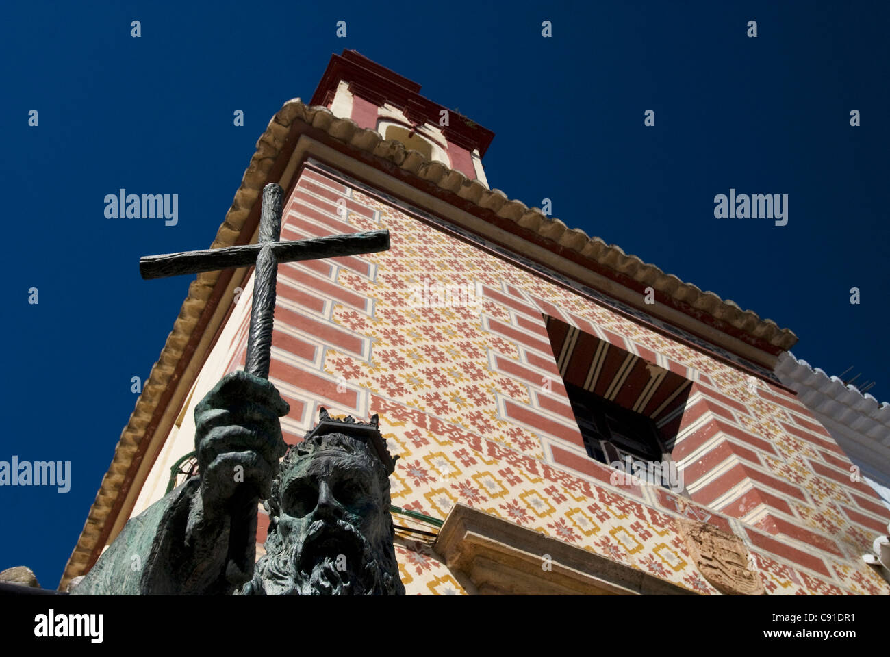 Iglesia de Nuestra Senora de La Paz stands in the centre of the old town of Ronda with a statue of Fray Diego Jose de Cadiz in Stock Photo