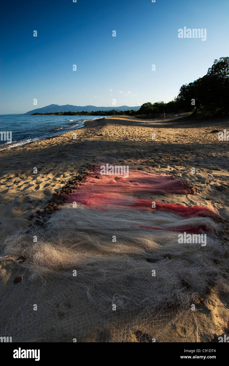 Bare boy lying on his belly on the beach in village of Chembe, Cape  Maclear, Malawi Stock Photo - Alamy