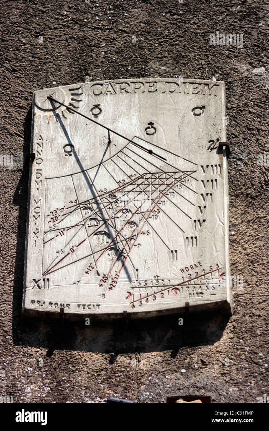 There are often sundials on the walls of cities such as Carcassonne. Stock Photo